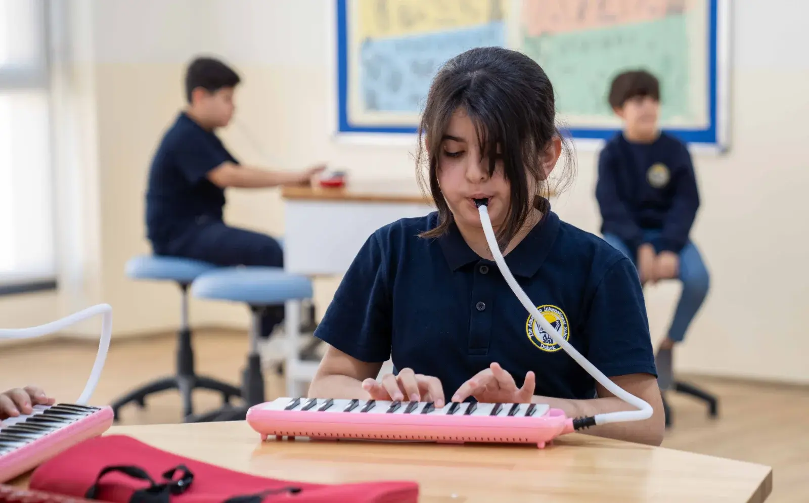 AIS student participating in a music class